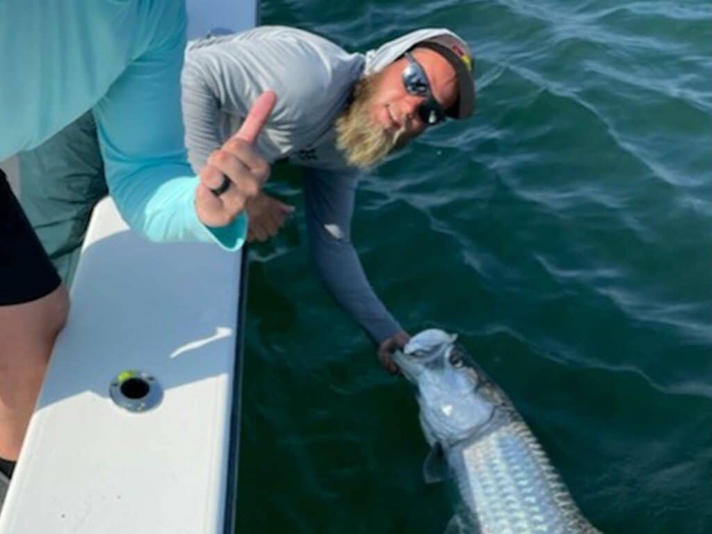 capt kyle with a tarpon