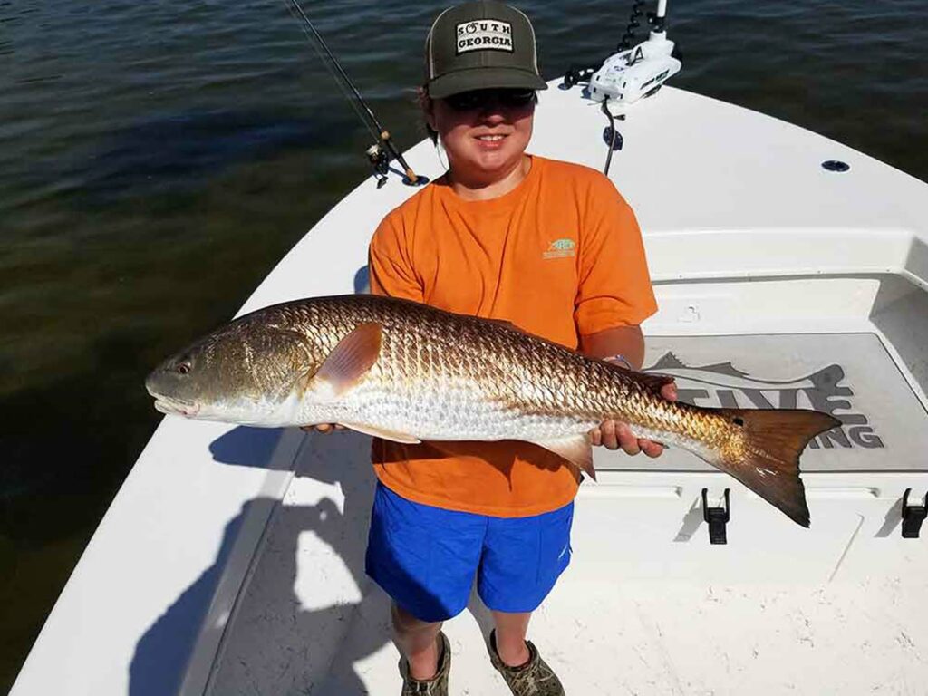 kid catches big redfish on st pete charter