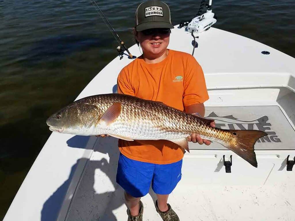 https://www.nativesportfishing.com/wp-content/uploads/2023/01/kid-catches-big-redfish-1024x768.jpg